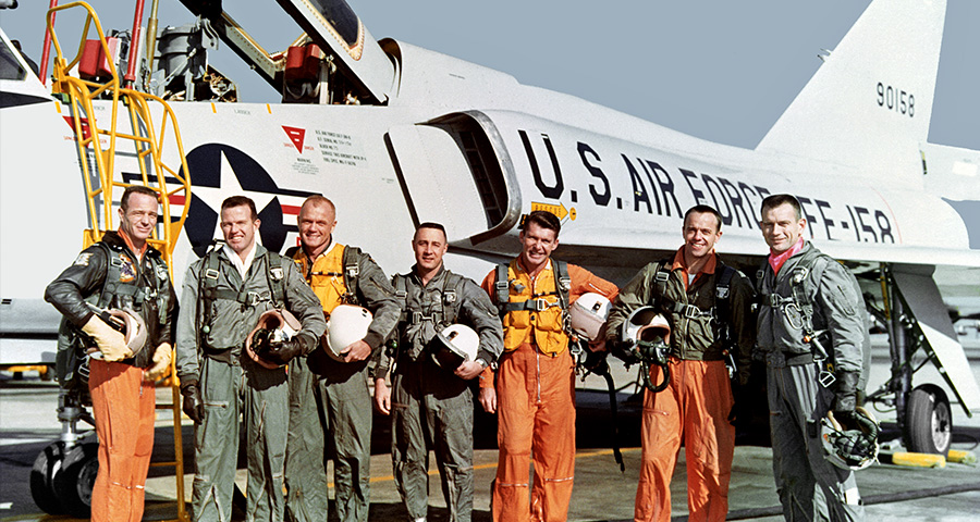 Orginal seven Mercury astronauts with a U.S. Air Force F-106B Delta Dart jet